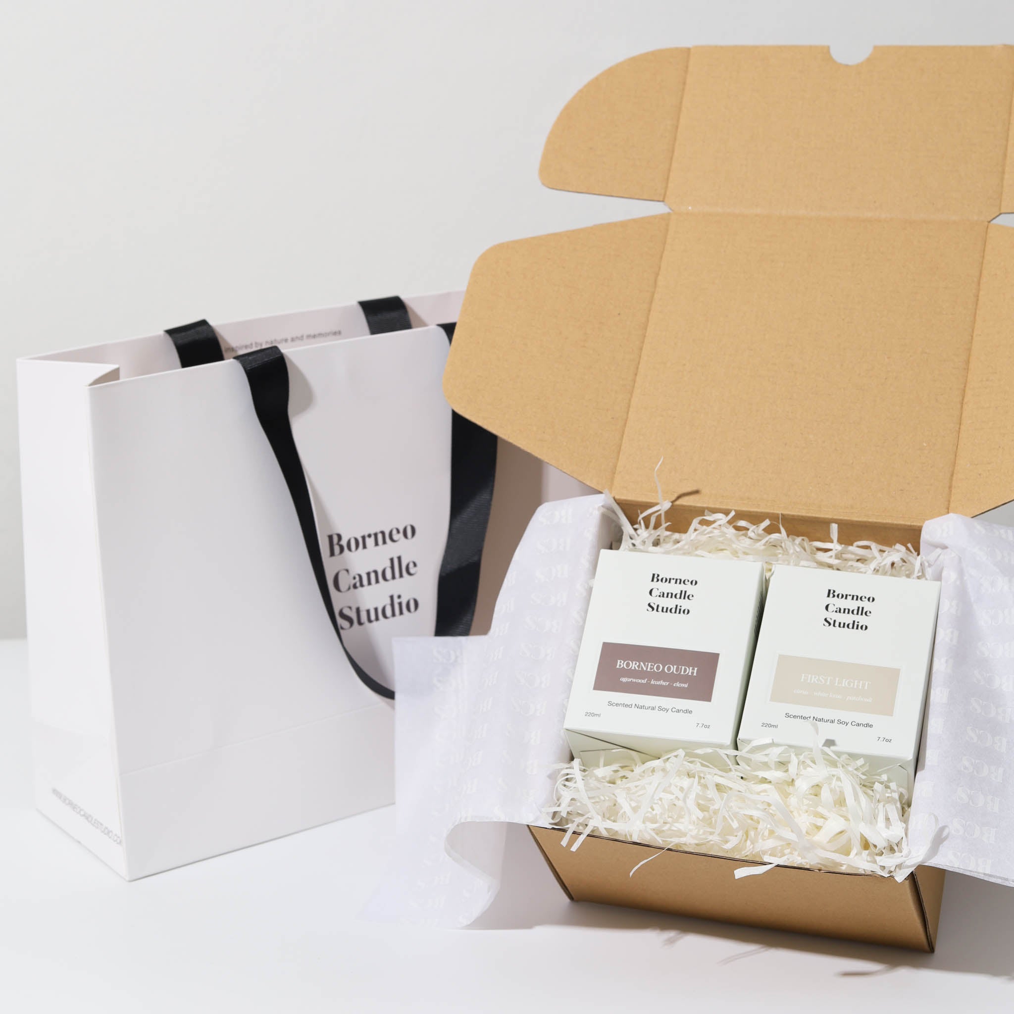 A customised candle gift box with Borneo Oudh and First Light scented candle. Gift box Malaysia.