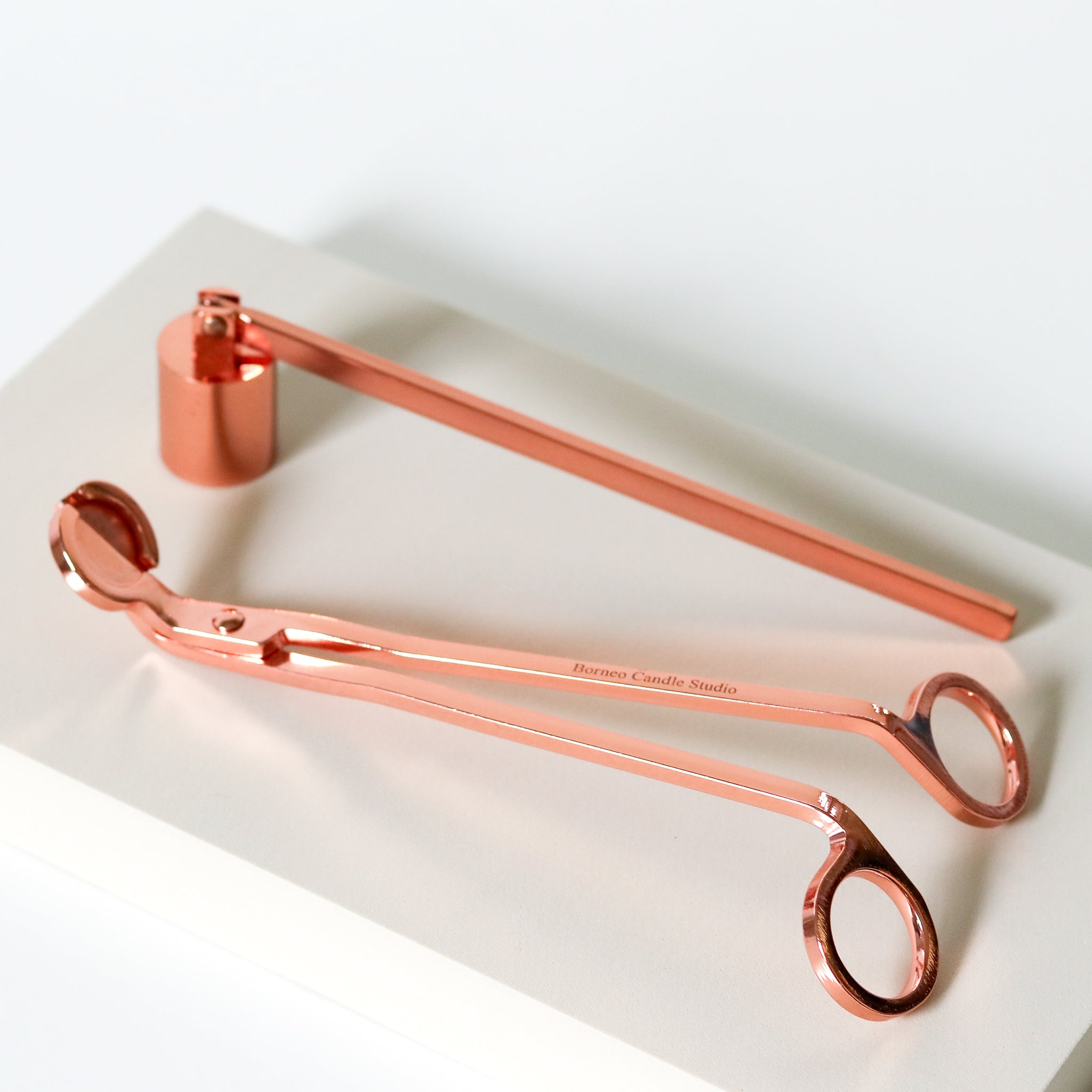Candle wick trimmer and candle snuffer in rose gold from Borneo Candle Studio