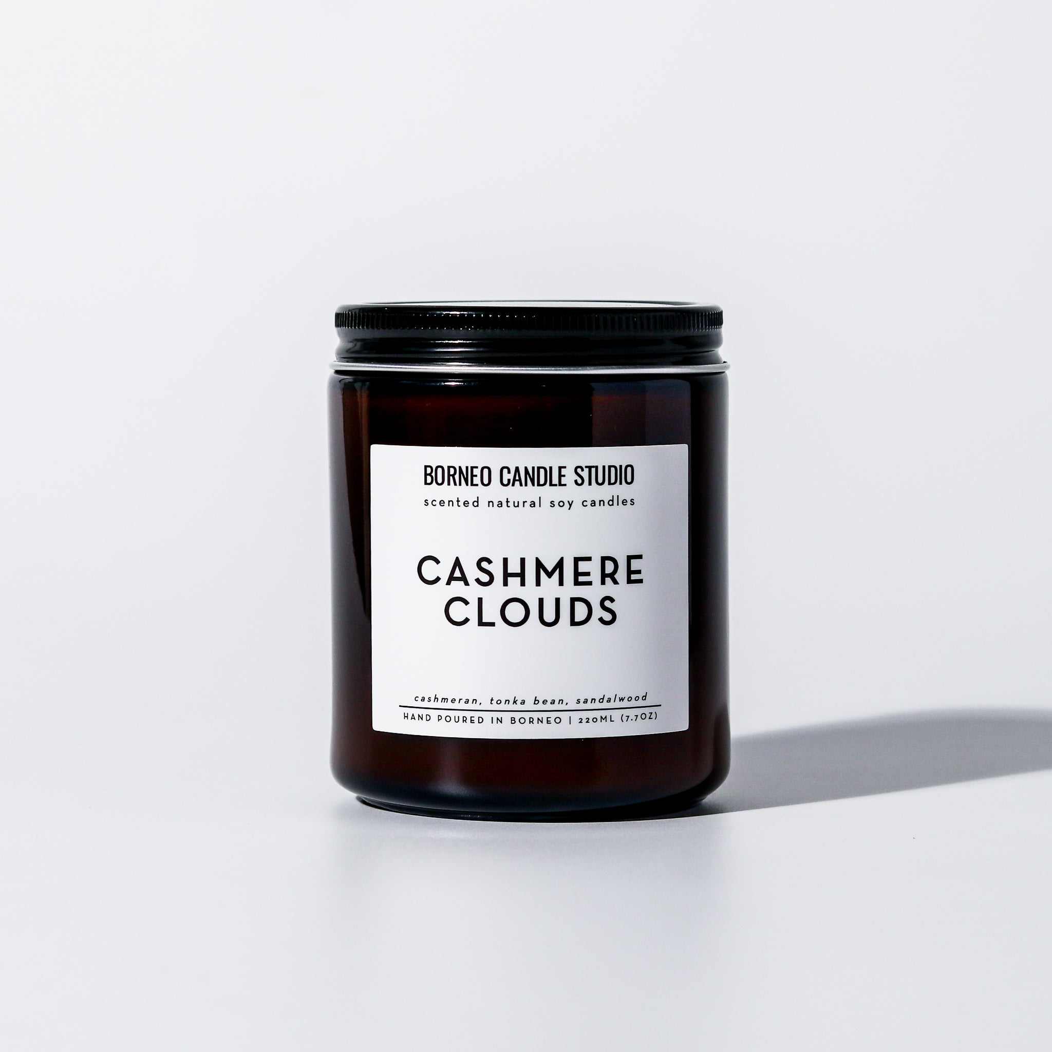 Cashmere Clouds Scented Candle - cashmere, tonka bean, sandalwood scented candle in 7.7 oz amber glass jar with lid