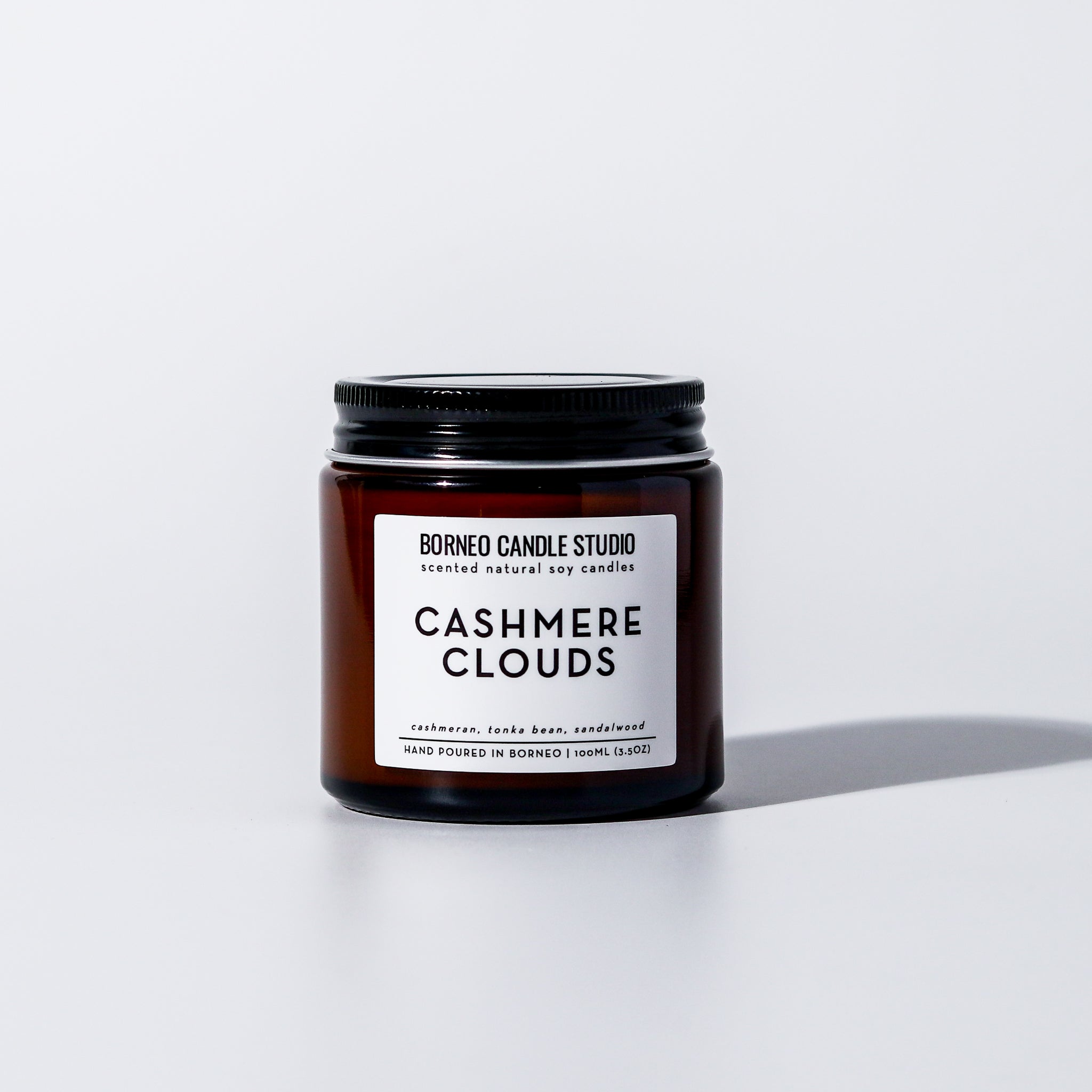 Cashmere Clouds Scented Candle - cashmere, tonka bean, sandalwood scented candle in 3.5 oz amber glass jar with lid
