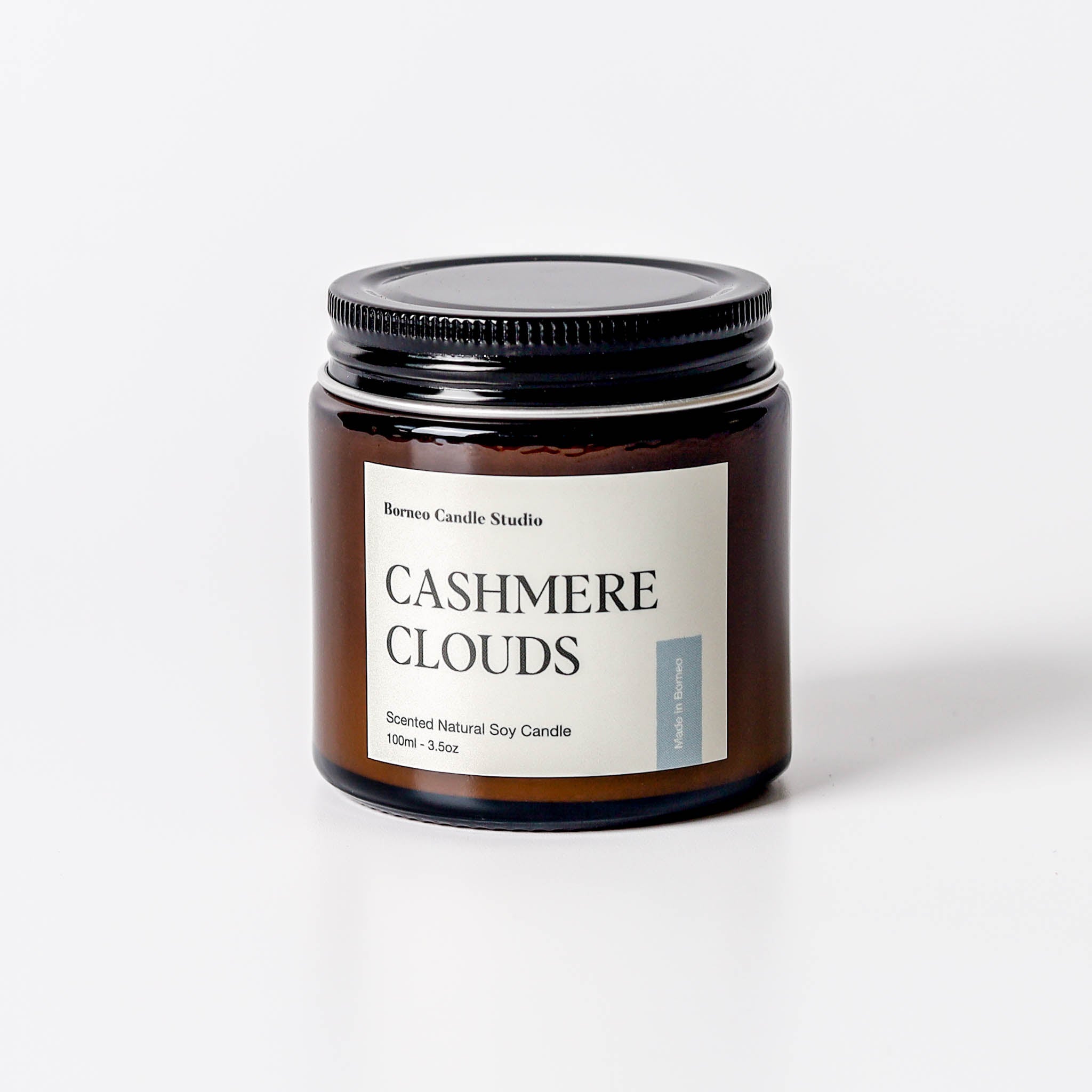 Cashmere Clouds Scented Candle - cashmere, tonka bean, sandalwood scented candle in 3.5 oz amber glass jar with lid