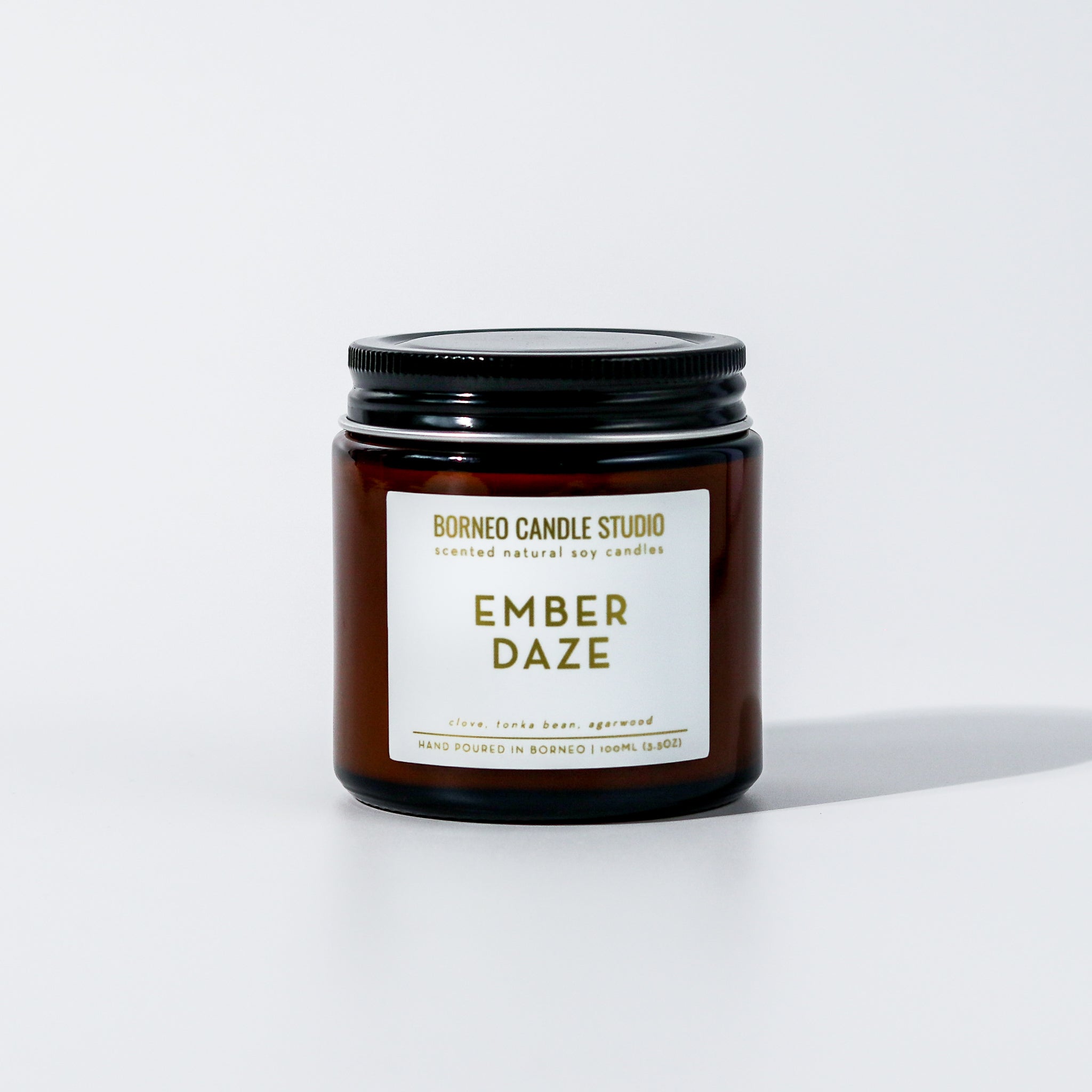 Ember Daze Holiday Christmas Scented Candle Borneo Candle Studio with notes of clove, tonka bean and agarwood